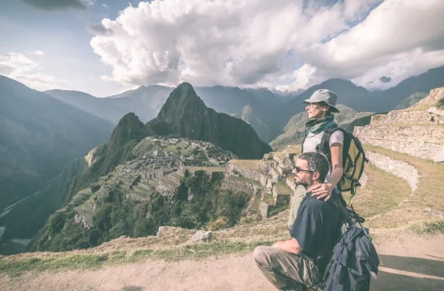 hugging-couple-looking-machu-picchu-peru-toned-image